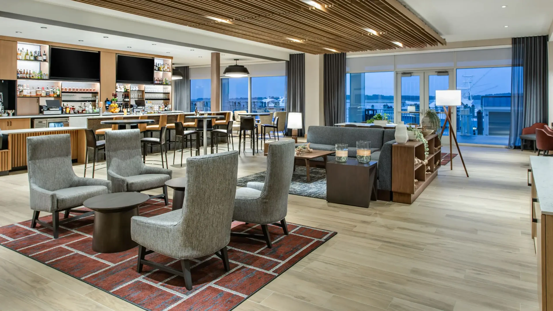 Hotel lobby lounge and bar with marina views
